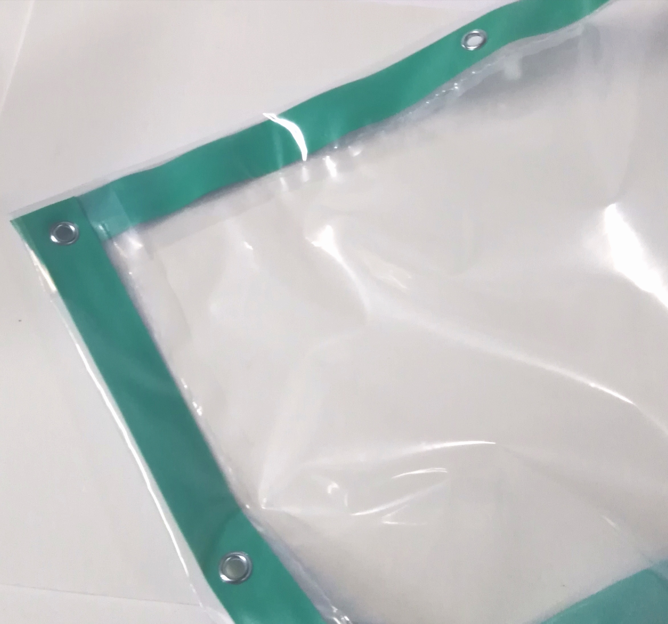 Teli in polietilene trasparente occhiellato con rinforzo in PVC 